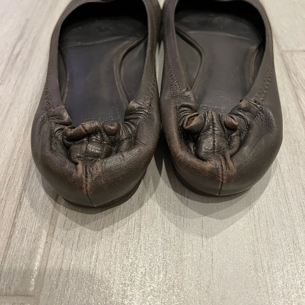 Tory Burch dark brown ballet flats with gold accent